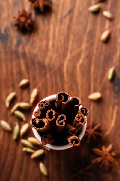 Cinnamon Sticks Red Ceramic Cup Rustic Brown Background Top View — Stock Photo, Image