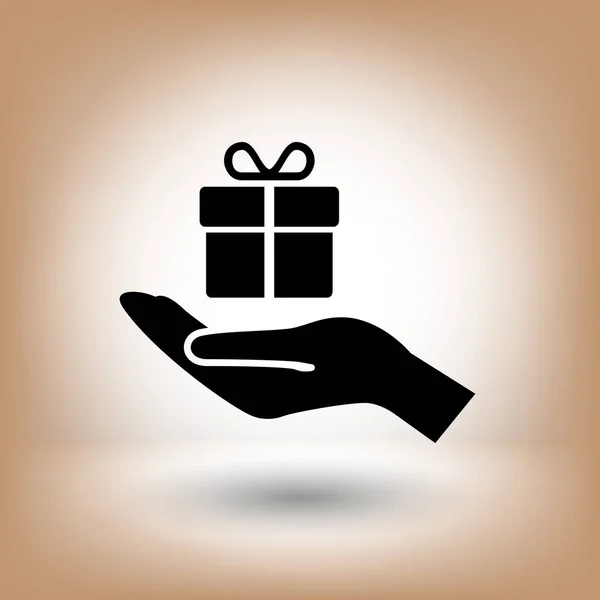 Boîte cadeau sur icône de la main — Image vectorielle