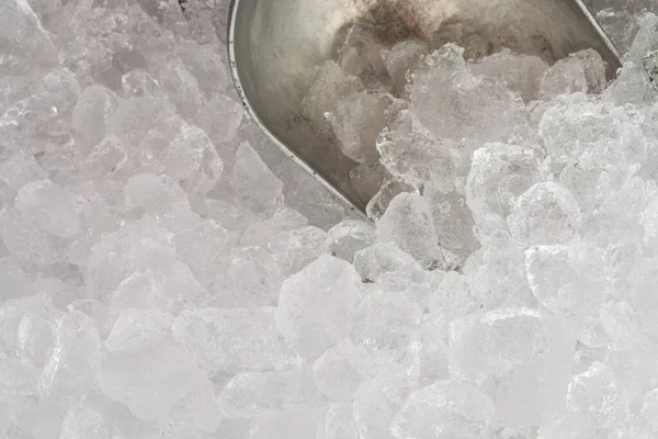 Ice Scoop on ice background.