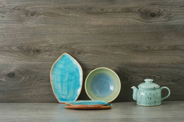 ceramic handmade dishes on a wooden background