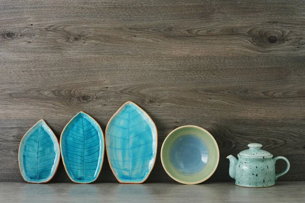 ceramic handmade dishes on a wooden background