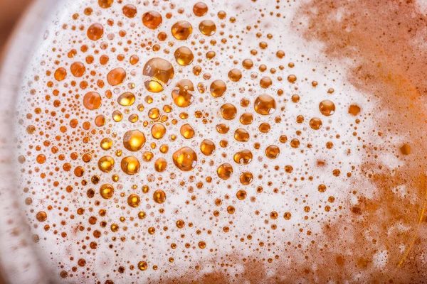 Light Beer with Bubbles and Foam Background. Beer Bubbles Texture Close Up.