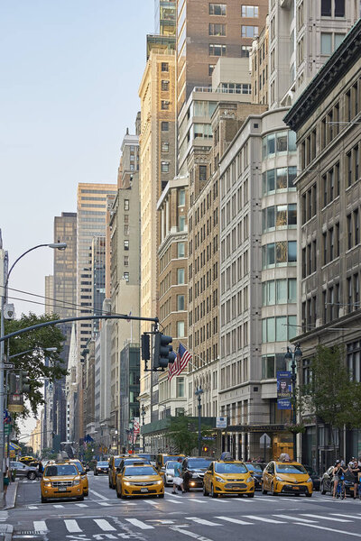 Streets of Manhattan, New York with blue skies in the background