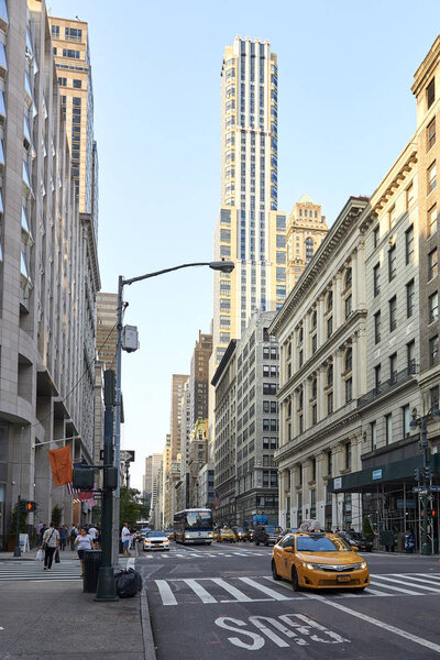 Streets of Manhattan, New York with blue skies in the background