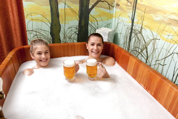 Beautiful women in a beer spa.