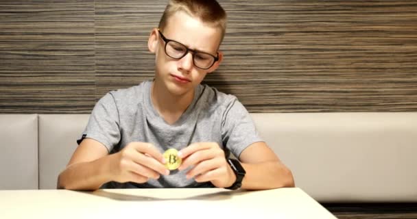 Young Boy Thinking Cryptography Investing Digital Currency Shot Spinning Bitcoin — Stock Video