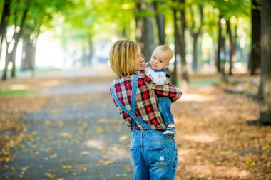 Young mother with a baby in her arms.