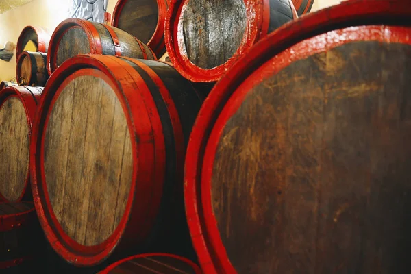 barrels of fresh wine, lie in a wine cellar