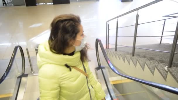 Woman Rides Escalator Subway Protective Medical Mask Viruses Bacteria — Stock Video