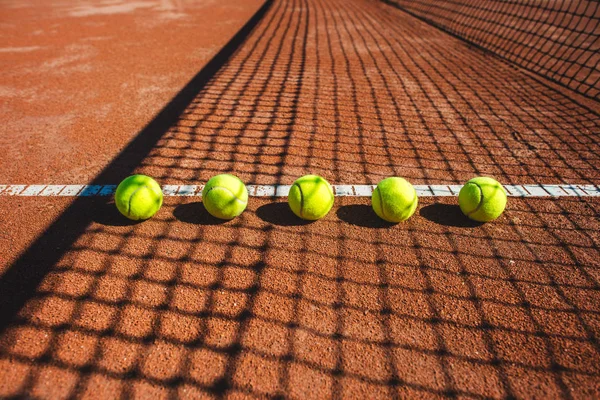 Tennis court line with balls