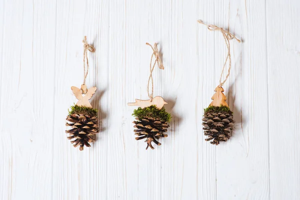 Handmade Christmas tree toys made of pine cone — Stock Photo, Image