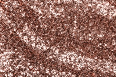 Parlak gül altın pulları tekstil arka planı.