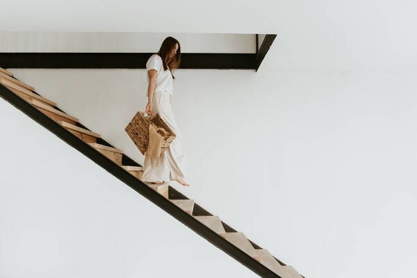 Woman going down the stairs.