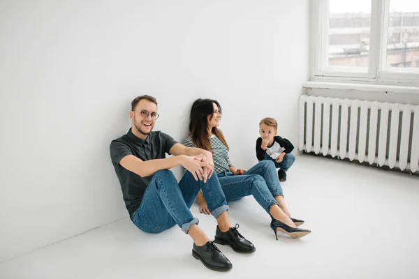 Hipster father, mother holding baby boy over white isolated background — Stock Photo, Image