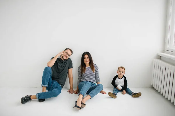 Hipster father, mother holding baby boy over white isolated background — Stock Photo, Image