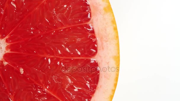 Rebanada giratoria de pomelo — Vídeo de stock