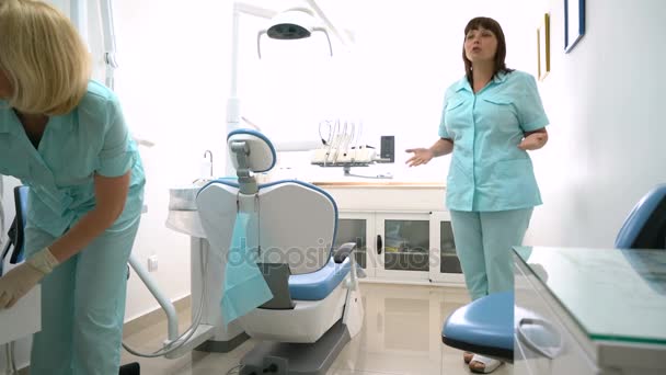 Dentist and nurse in the dental office — Stock Video