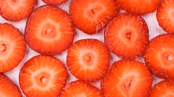 Rotating background of sliced strawberry — Stock Video