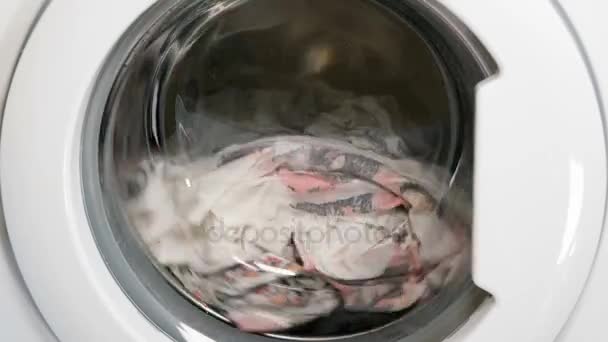 Washing machine is washing clothes — Stock Video