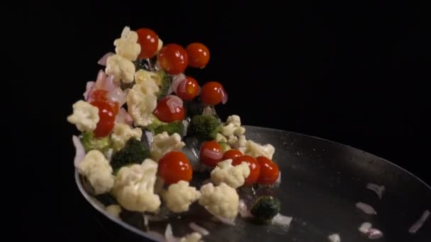 Stirring vegetables in a frying pan — Stock Video