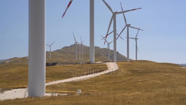 Windmills converting wind energy into electricity — Stock Video