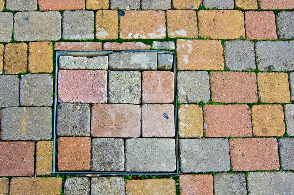 Paving stone blocks with manhole — Stock Photo, Image