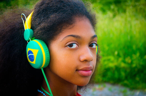 Brazilian girl scolta music while waiting for the Olympic Games