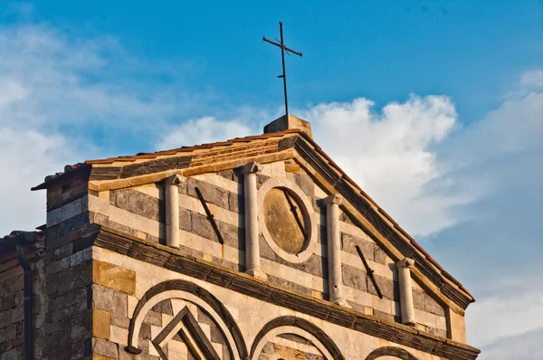 Front of the ancient Romanesque church with black and white marb — Stock Photo, Image