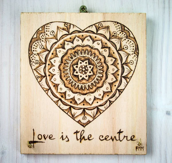 The ancient art of pyrography, wood and fire, mandala — Stock Photo, Image