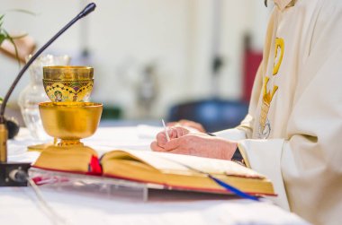 altar with consecrated host that becomes the body of jesus christ and chalice for wine, blood of christ, in the church of francesco papa in rome clipart