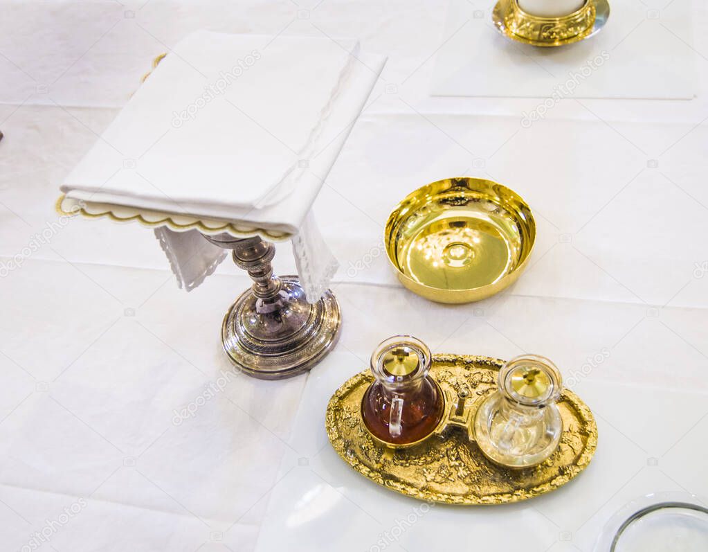 chalice for wine, blood of christ, and ciborium with host, body of christ, and ampoules with wine and water for the consecration on the others of the churches for pope francesco