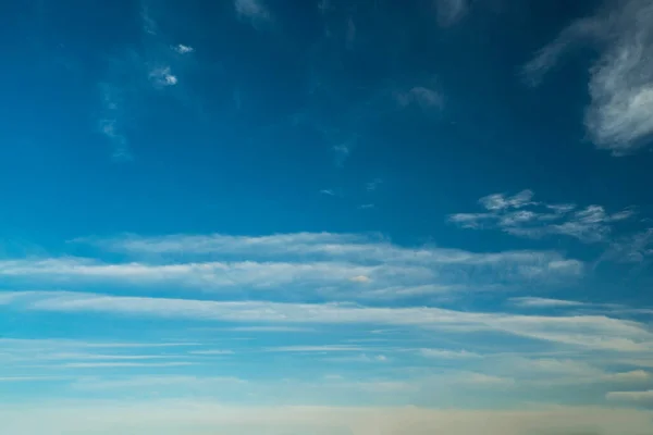 Feather clouds in the blue sky during the day