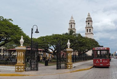 CAMPECHE, MEXICO-MARCH 13, 2018: independence park with cathedral san francisco de campeche, mexico clipart