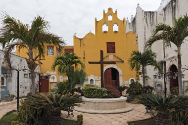 CAMPECHE, MEXICO-MARCH 13, 2018: Garden of the Cathedral san francisco de campeche with musem, mexico clipart