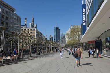FRANKFURT AM MAIN, GERMANY - APRIL 18, 2018: people walk in the morning on the pedestrian zone Zeil in frankfurt am main, germany clipart