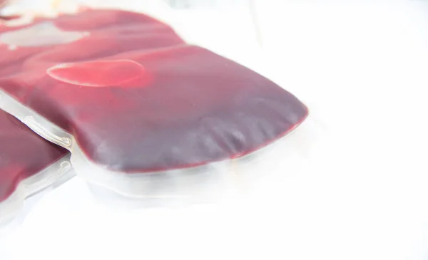 Blood bag on white laboratory blurred background. — Stock Photo, Image