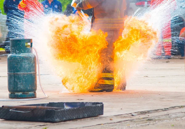 Firefighters training with fire outdoor — Stock Photo, Image