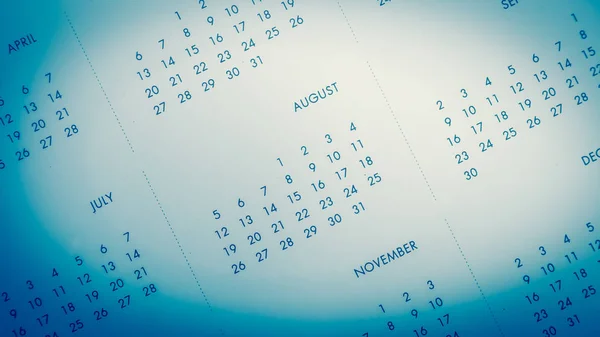 Niewyraźne kalendarz na niebieskim odcieniu. — Zdjęcie stockowe