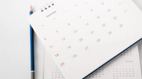 Blurred calendar page on white background. — Stock Photo, Image