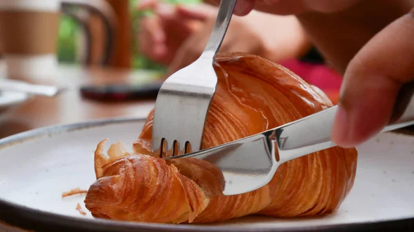 Freshly baked croissants on white plate, top view — ストック写真