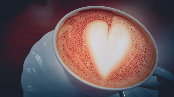 Close up Coffee heart shape in white cup.