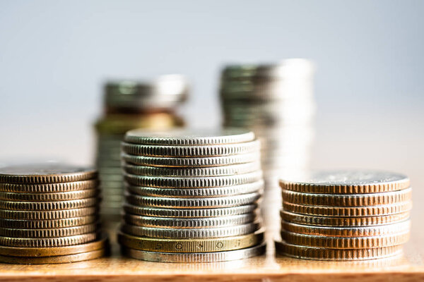 Close up group of coins on blurred background in business concept.