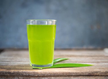 Close up green pandan juice in healthy drinking concept. clipart