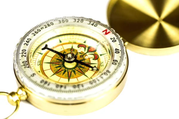 Tourist compass in macro on a white. — Stock Photo, Image