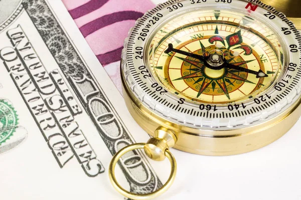 Tourist compass with banknotes on white — Stock Photo, Image
