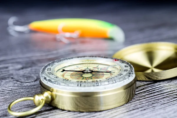 Fishing tackles with compass — Stock Photo, Image