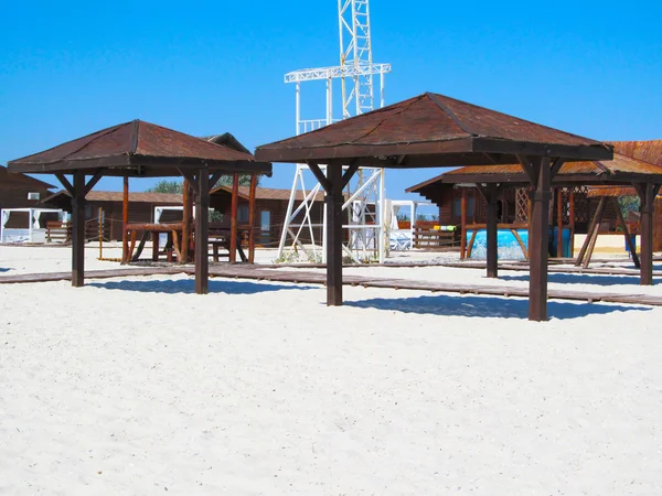 Beach umbrellas at the seaside — Stock Photo, Image