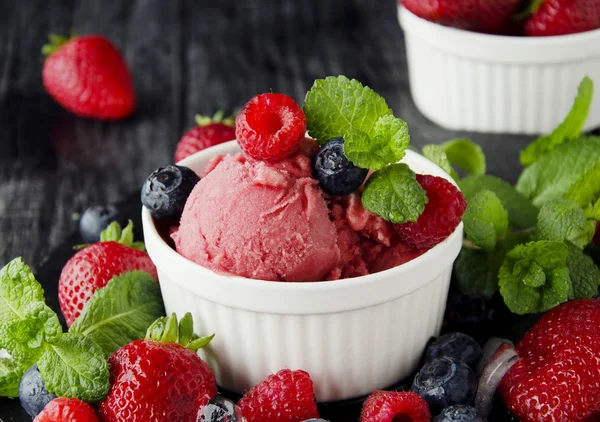 fruit ice cream with fresh strawberries, blueberries and raspberries