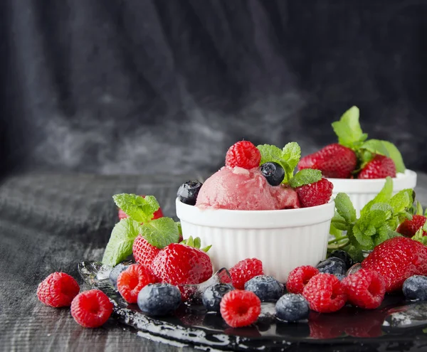 fruit ice cream with fresh strawberries, blueberries and raspberries