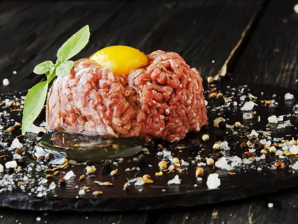 Raw minced meat, vegetables with salt and spices, selective focus — Stock Photo, Image